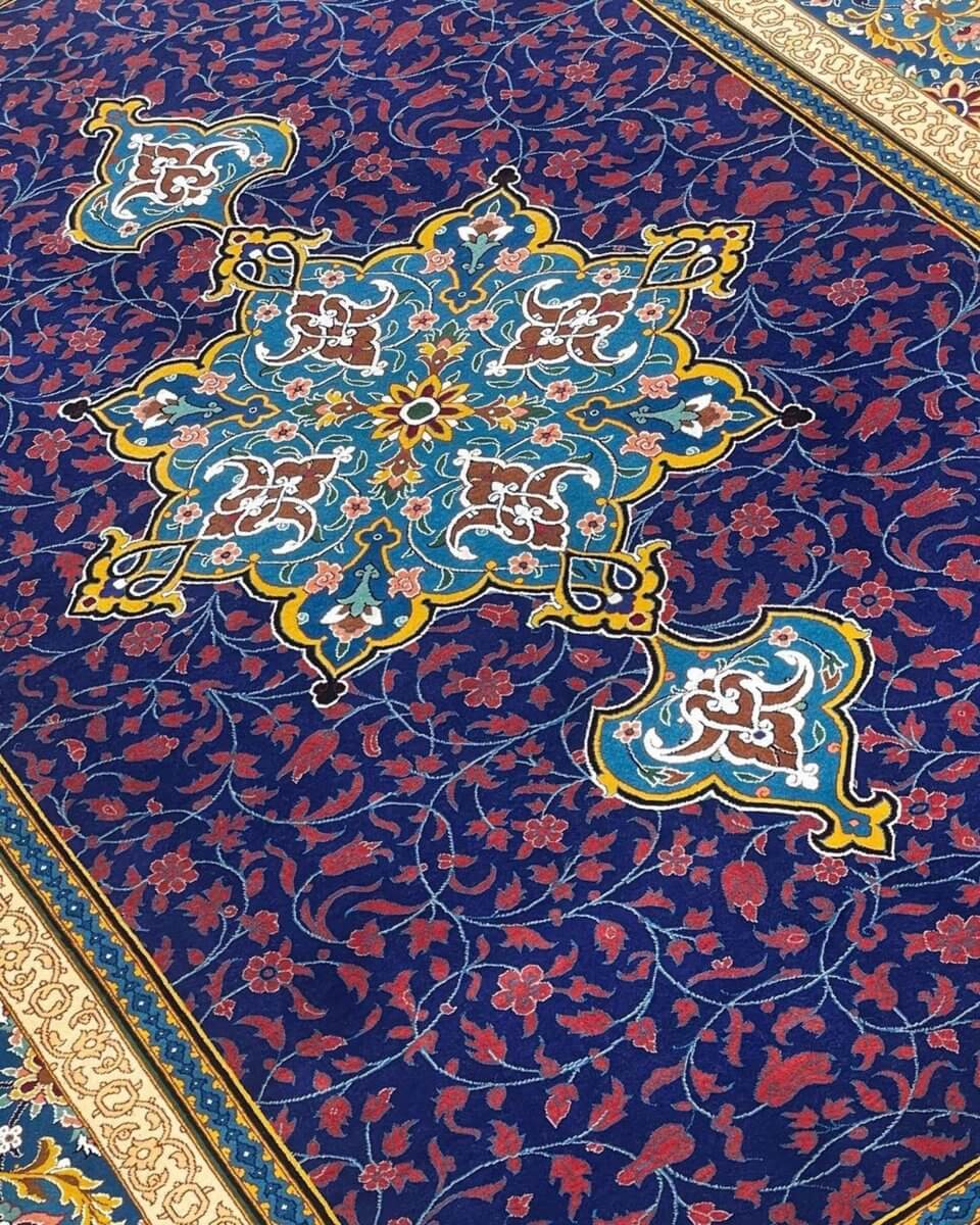 "Handmade luxury designer rug in blue and gold from Isfahan"
